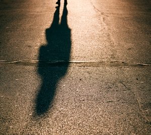 mans-shadow-on-sidewalk